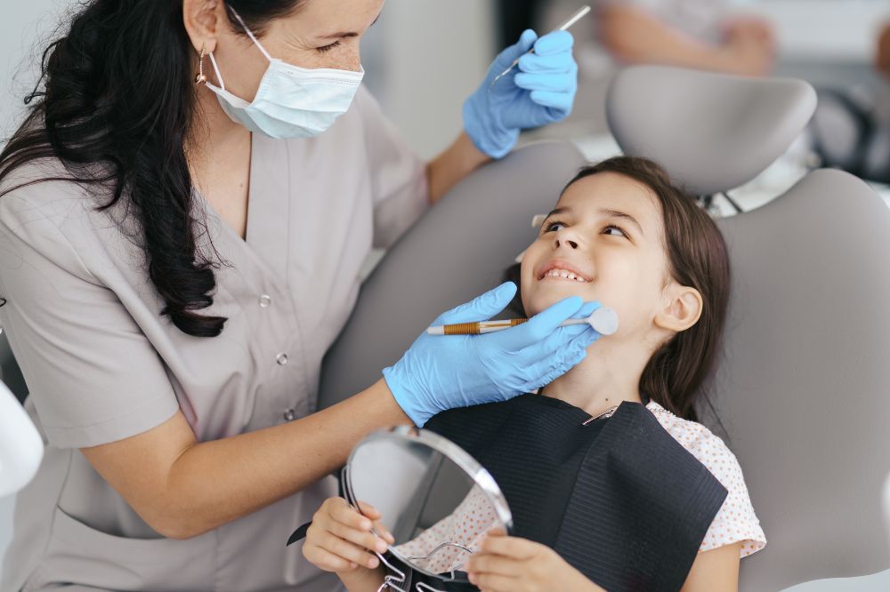 a little girl is having chirldrens dentistry treatment